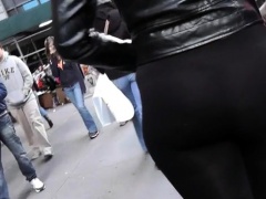 Street voyeur follows a slender babe in see-through pants