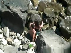 Teen couple spied fucking between the rocks