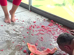 feeding with water melons from feet