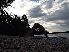 Slim nudist boy doing yoga naked on a nudist beach. Nude yoga video by John Artin, gay porn model, skinny naturist, twink, practice