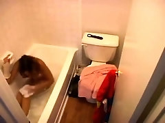 Shower voyeur films a sexy teen undressing and taking a bath