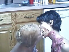 Older and younger lesbians rub food all over each other on the floor