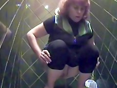 Busty beauty is pissing in the hot toilet