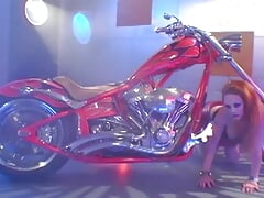 Busty redheaded biker girl gets her thick booty dicked down vigorously on her precious bike