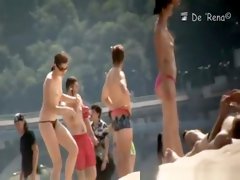 Nudist couple by the water